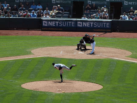 Blue Jays vs. Athletics: Athletics Mark Ellis connects with pitch from Blue Jays Casey Janssen.  Taken on August 18 2010 at Coliseum in Oakland California.のeditorial素材