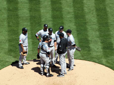 Blue Jays vs. Athletics: Blue Jays have a meeting on the mound with coach to discuss what to do during upcoming play.  Taken on August 18 2010 at Coliseum in Oakland California.のeditorial素材