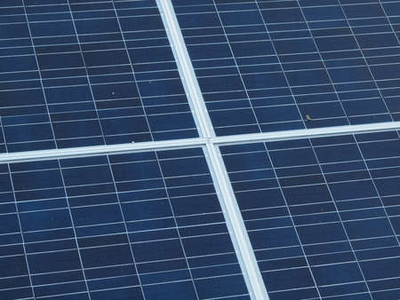 top view solar panel mounted as a canopy on the side of a building of a  baseball ballparks.  Little...