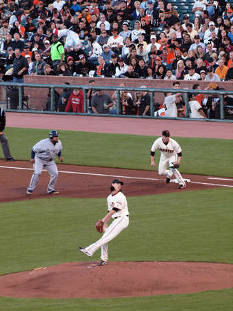 Brewers vs. Giants: Brewers Prince Fielder takes lead at 1st as Giants Tim Lincecum steps into a throw.  September 18 2010 at the ATT Park San Francisco California.のeditorial素材