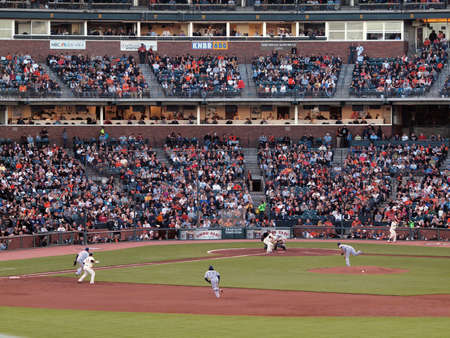 Brewers vs. Giants: Giants Tim Lincecum sets to bunt incoming pitch as Cody Ross takes lead from 1st.  September 18 2010 at the ATT Park San Francisco California.のeditorial素材
