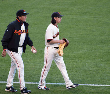 Brewers vs. Giants: Giants two time Cy Young award winner pitcher Tim Lincecum walks towards the mound with pitching coach.  September 18 2010 at the ATT Park San Francisco California. のeditorial素材