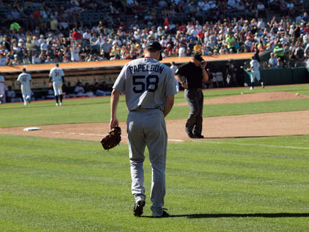 Red Sox vs. A's: Red Sox closer Jonathan Papelbon walks towards the mound to close out the 9th inning.  September 12 2010 Coliseum Oakland California.のeditorial素材