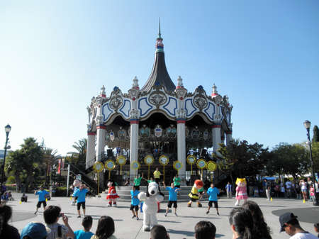 Snoopy and Friends dances in front of double-decker Carousel during show call 'Peanuts Party in the Plaza'.  August 7, 2010 Great America Park Santa Clara, California.のeditorial素材