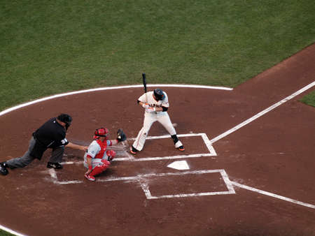 SAN FRANCISCO, CA - OCTOBER 20: San Francisco Giants vs. Philadelphia Phillies: Giants Freddy Sanchez looks at incoming pitch as it flies across the plate with Carlos Ruiz catching game four of the NLCS 2010 taken October 20, 2010 AT&T Park San Francisco のeditorial素材