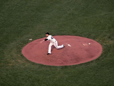 SAN FRANCISCO, CA - OCTOBER 20: San Francisco Giants vs. Philadelphia Phillies: Giants Madison Bumgarner steps forward as he releases pitch from mound, ball visible moving inthe air, during game four of the NLCS 2010 taken October 20, 2010 AT&T Park San Fのeditorial素材