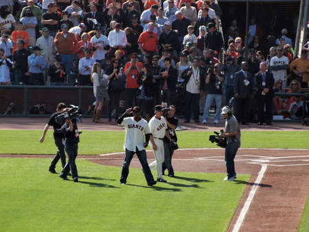 SAN FRANCISCO, CA - OCTOBER 19: San Francisco Giants vs. Philadelphia Phillies: Home Run King Barry Bond smiles at cheering fans after throwing out first pitch of game three of the NLCS 2010 taken October 19, 2010 AT&T Park San Francisco California. のeditorial素材