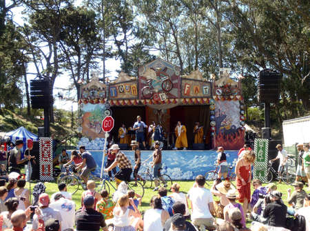 The Slow race at Tour De Fat 2010 with man in robes rapping in the background include electric guitars.   September 25, 2010 Golden Gate Park San Francisco.のeditorial素材