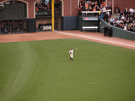 SAN FRANCISCO, CA - OCTOBER 28: outfielder Cody Ross throws ball to warm up between innings of game 2 2010 World Series game between Giants and Rangers Oct. 28, 2010 AT&T Park San Francisco, CA. のeditorial素材