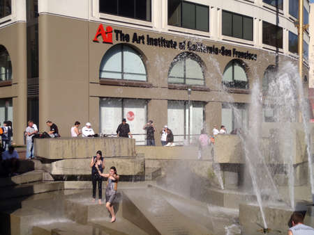SAN FRANCISCO, CA - NOVEMBER 3: Giants fans jump into the water fountain and dance to celebrate after world championship parade with other fans watching Nov. 3, 2010 San Francisco, CA. のeditorial素材