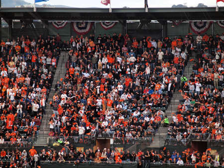 SAN FRANCISCO, CA - OCTOBER 28: Giants fans in the upperdeck stand and cheer at the sell out event of game 2 of the 2010 World Series game between Giants and Rangers Oct. 28, 2010 AT&T Park San Francisco, CA.のeditorial素材