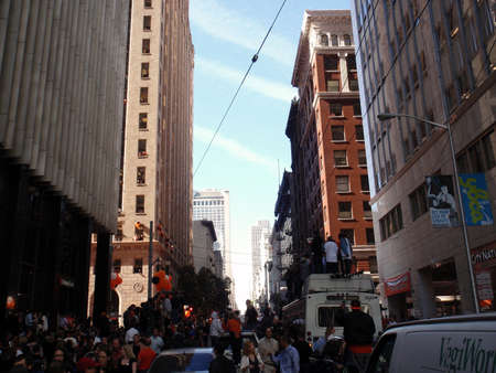 SAN FRANCISCO, CA - NOVEMBER 3: Giants fans stand on anything they can and celebrate the parade as confetti falls from the sky  Nov. 3, 2010 San Francisco, CA.のeditorial素材
