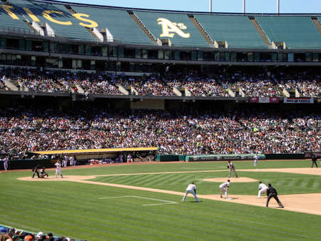 OAKLAND - MAY 23: Bay Bridge Series: Giants Jonathan Sanchez stands on the mound and prepares to throw with runner at 1st and Kurt Suzuki in the batters box May 23, 2010 Coliseum Oakland California. のeditorial素材