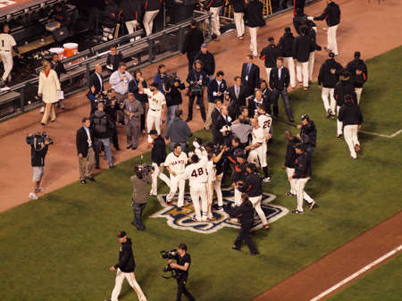 SAN FRANCISCO, CA - OCTOBER 20: Giants celebrate victory over the Phillies outside of the dugout with cameramen recording game 4 of the 2010 NLCS game between Giants and Phillies Oct. 20, 2010 AT&T Park San Francisco, CA. のeditorial素材