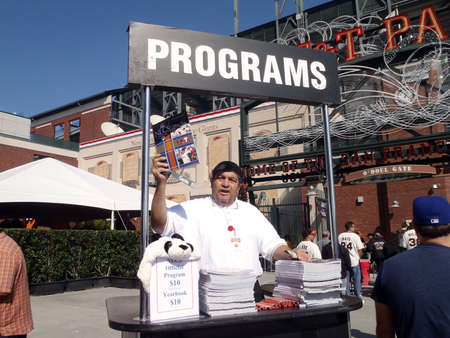 SAN FRANCISCO, CA - OCTOBER 19: San Francisco Giants vs. Philadelphia Phillies: Man sells programs outside ballpark before the start of NLCS game three of the NLCS 2010 taken October 19, 2010 AT&T Park San Francisco California. のeditorial素材