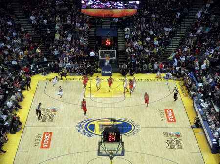 OAKLAND, CA - DECEMBER 25: Portland Blazers vs. Golden State Warriors: Players begin sprinting down the the court during fastbreak at the Oracle Arena taken December 25, 2010 Oakland California.のeditorial素材