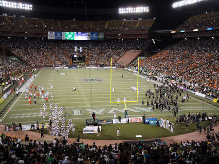 HONOLULU, HI - DECEMBER 4: UNLV vs. UH: Teams walk towards locker rooms at half time of football...