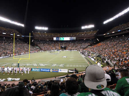 HONOLULU, HI - DECEMBER 4: UNLV vs. UH: fans taking in the football action across the field of football game. taken on December 4, 2010 at Aloha Stadium in Honolulu, Hawaii.のeditorial素材