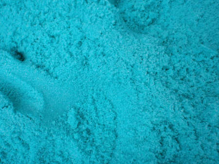 large amount of blue bath salt with scoop holes in it. Good pattern.の写真素材