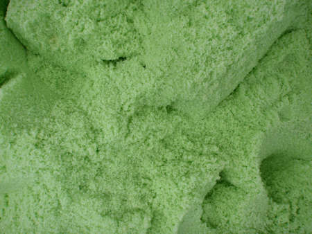 large amount of light green bath salt with scoop holes in it. Good pattern.の写真素材