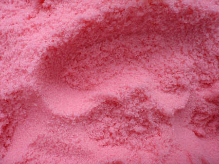 large amount of bright pink bath salt with scoop holes in it. Good pattern.の写真素材