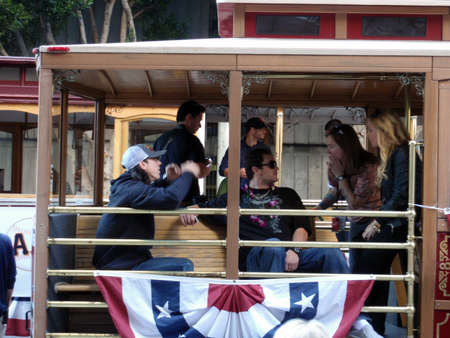 SAN FRANCISCO, CA - NOVEMBER 3: Giants Tim Lincecum wearing a Red Bull hat and dan runzler sit on Trolley and talk story before the start of world championship parade Nov. 3, 2010 San Francisco, CA.のeditorial素材