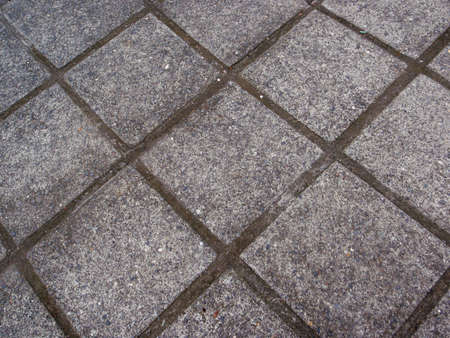 worn Diamond shaped concrete stone pathwayの写真素材