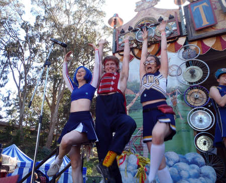 SAN FRANCISCO - SEPTEMBER 25: Cheerleadrer of Mucca Pazza, a self-described "circus-punk marching band" Cheerleaders raise arms into the air during performance at Tour De Fat. September 25, 2010 Golden Gate Park San Francisco. のeditorial素材