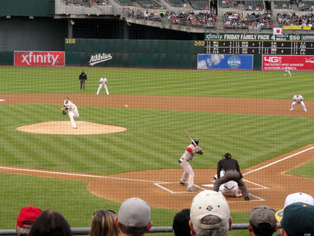 OAKLAND, CA - APRIL 19: Red Sox vs. A's:  As Pitcher brett anderson throws pitch to Red Sox batter jed lowrie with ball in air seen from behind net. April 19, 2011 Oakland coliseum California のeditorial素材