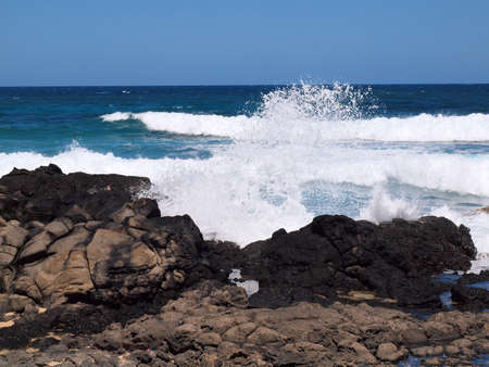 Wave crash and burst into the air at Makapuu beach on Oahu Hawaii の写真素材