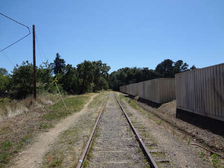 Old train track stretches into the distance in Marin, Californiaの写真素材