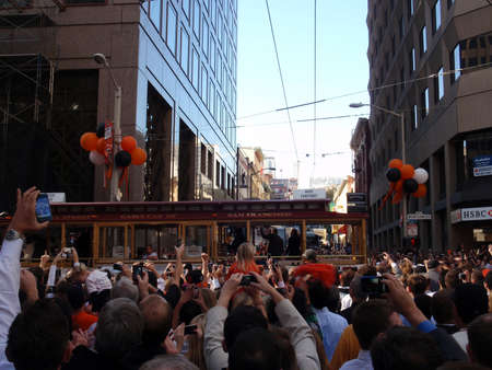SAN FRANCISCO, CA - NOVEMBER 3: Giants fans celebrate the passing of trolleys featuring Mike Fontenot during championship parade with fans waving and taking photos Nov. 3, 2010 San Francisco, CA. のeditorial素材