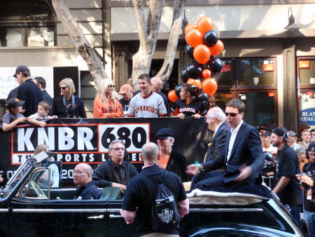 SAN FRANCISCO - NOVEMBER 3: KNBR Crew on Open Car before start of World Series Win Celebration Parade taken on October 10, 2010 in San Francisco.のeditorial素材