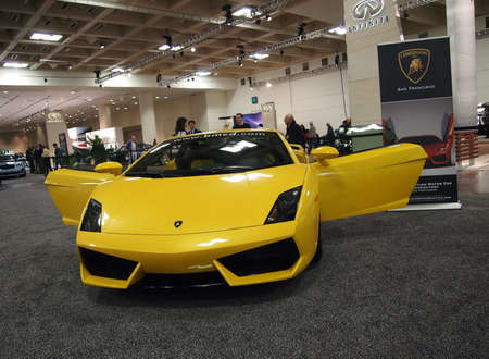 SAN FRANCISCO, CA - NOVEMBER 23:  Yellow Lamborghini Car with Doors open on display at the International Auto Show on November 23 2011 in San Francisco California.のeditorial素材