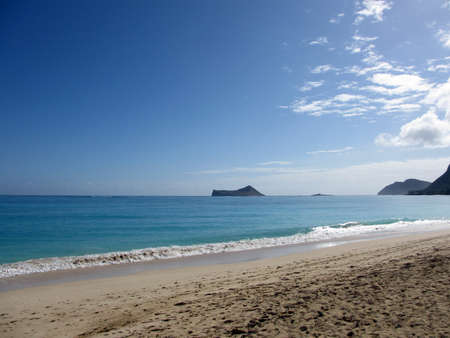 Waimanalo Beach on Oahu, Hawaii  With rock and rabbit island seen in the distanceの写真素材