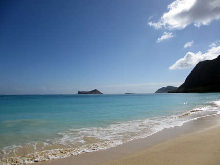 Waimanalo Beach on Oahu, Hawaii  With  rabbit and rock island seen in the distanceの写真素材