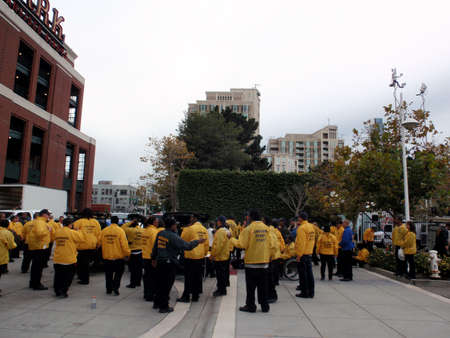 SAN FRANCISCO, CA - OCTOBER 27: Landmark Event Staff gather outside ballpark wearing yellow rain jackets as they prepare for event at ATT Park on October 27, 2010 in San Francisco.のeditorial素材