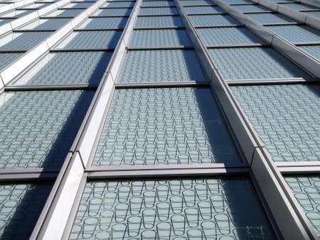 Modern Blue Windows with pattern on glass looking upward 