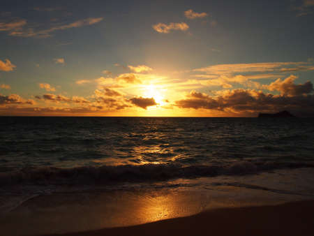 Sunrise Waimanalo Beach on Oahu, Hawaii. With  rabbit island seen in the distanceの写真素材