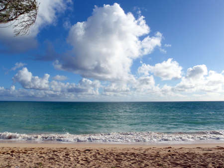 water breaks on the shore of an empty Waimanalo Beach on Oahu, Hawaii の写真素材