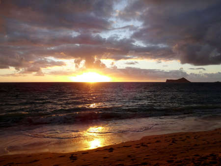 Early Morning Sunrise on Waimanalo Beach on Oahu, Hawaii with rabbit island seen in the distance の写真素材