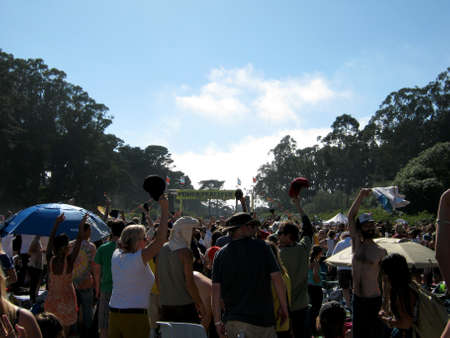 SAN FRANCISCO - SEPTEMBER 11: People raise their hats and hands into the air as Michael Franti and Spearhead Plays at Power to the Peaceful 2010 Music Festival. September 11, 2010 at Golden Gate Park San Francisco.のeditorial素材