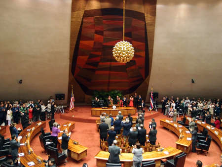 HONOLULU, HI - JANUARY 14: Former U.S. Senator Daniel Akaka gets standing ovation from audience which includes the Hawaii state Legislature and the Governor Neil Abercrombie of which surround him on stage. January 14, 2013 at the State Capitol in Honoluluのeditorial素材