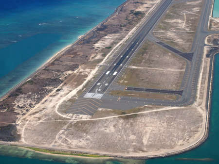  Honolulu International Airport Coral Runway seen from the air with surrounding water on Oahu, Hawaii.の写真素材