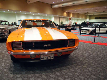 SAN FRANCISCO, CA - NOVEMBER 23: Orange Classic Camaro RS Car with a racing strip on display at the 54rd International Auto Show November 23 2011 San Francisco.のeditorial素材