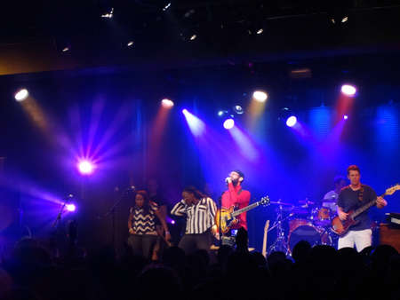 HONOLULU - DECEMBER 14, 2013: Reggae band Groundation jams on stage with lead singer singing into mic and other members of band play music at concert at the Republik.のeditorial素材