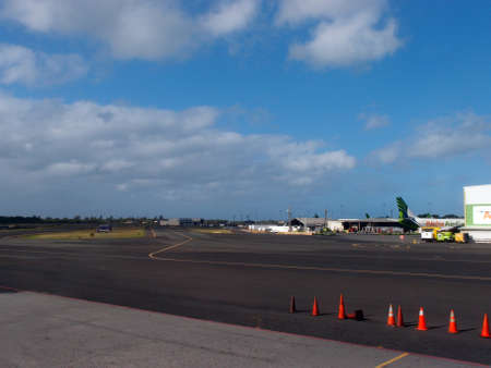 HONOLULU, HI - FEBRUARY 18: Empty Honolulu international airport runway with a Aloha Air Cargo jet airplane in the corner at Honolulu Airport, February 18 2013 in Honolulu, Hawaii.のeditorial素材