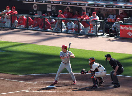 SAN FRANCISCO, CA - OCTOBER 19: San Francisco Giants vs. Philadelphia Phillies: Philles Chase Utley stands into the batters box with bat on shoulder and Catcher Buster Posey squatting during game three of the NLCS 2010 taken October 19, 2010 AT&T Park Sanのeditorial素材