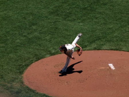SAN FRANCISCO - JUNE 16: Giants two time Cy Young award winner Tim Lincecum finishes throwing a pitch by lifting back leg high into the air during a day game.  June 16 2010 Att Park San Francisco Californiaのeditorial素材