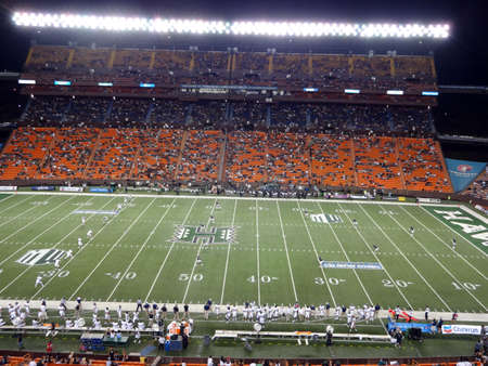 HONOLULU - SEPTEMBER 22: UH Hawaii Warriors sets up to kickoff the ball to Nevada Wolf Pack at night with whole view of field at Aloha Stadium in Honolulu, Hawaii on September 22, 2012. のeditorial素材